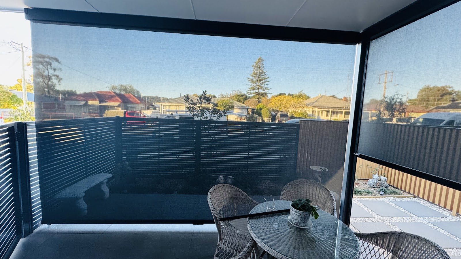 Outdoor blinds enclosing a patio dining area