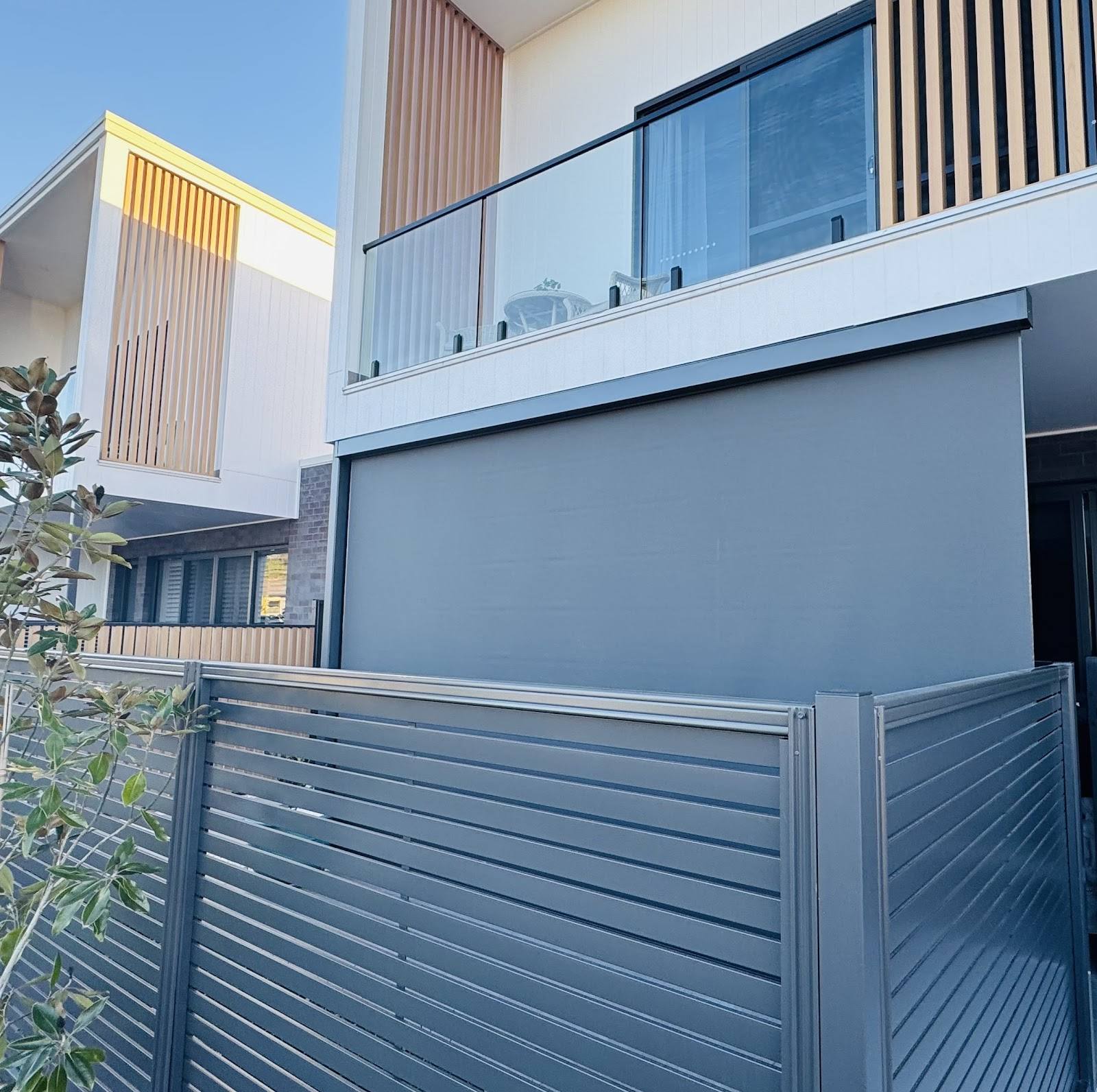Outdoor blinds on a townhouse patio, installed by CBI Blinds